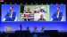 Screen Shot von Konferenz in Cernobbio, auf der man sieht Erwin Rauch oben links und rechts live in einem weißen Stuhl bei Veranstaltung sieht. 